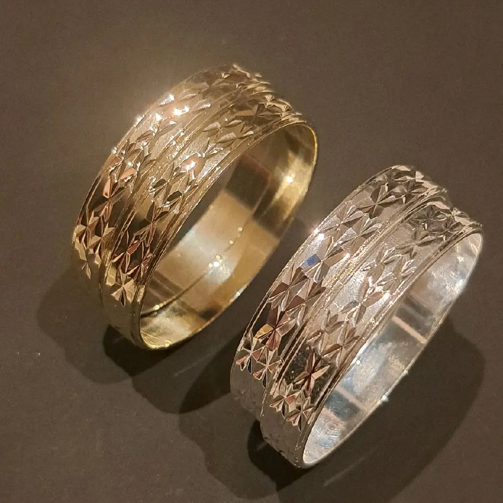 babies carved bangles. set of 2. gold or silver  plated and stainless. 45mm fits about 2 years old