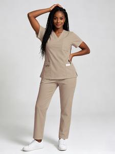 Women's Stretch Workwear Scrubs Set That Breathes! Featuring a trendy jogger style with multiple pockets, this smooth, quick-drying uniform lets you say goodbye to wrinkles & stuffiness for work and beyond.
